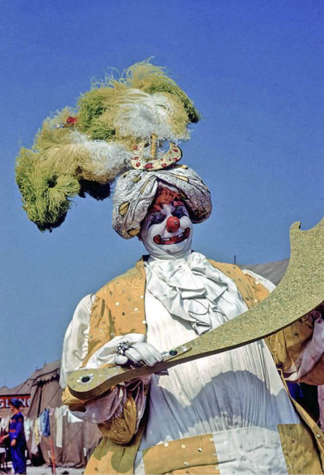 Felix Adler, a clown in spec wardrobe.