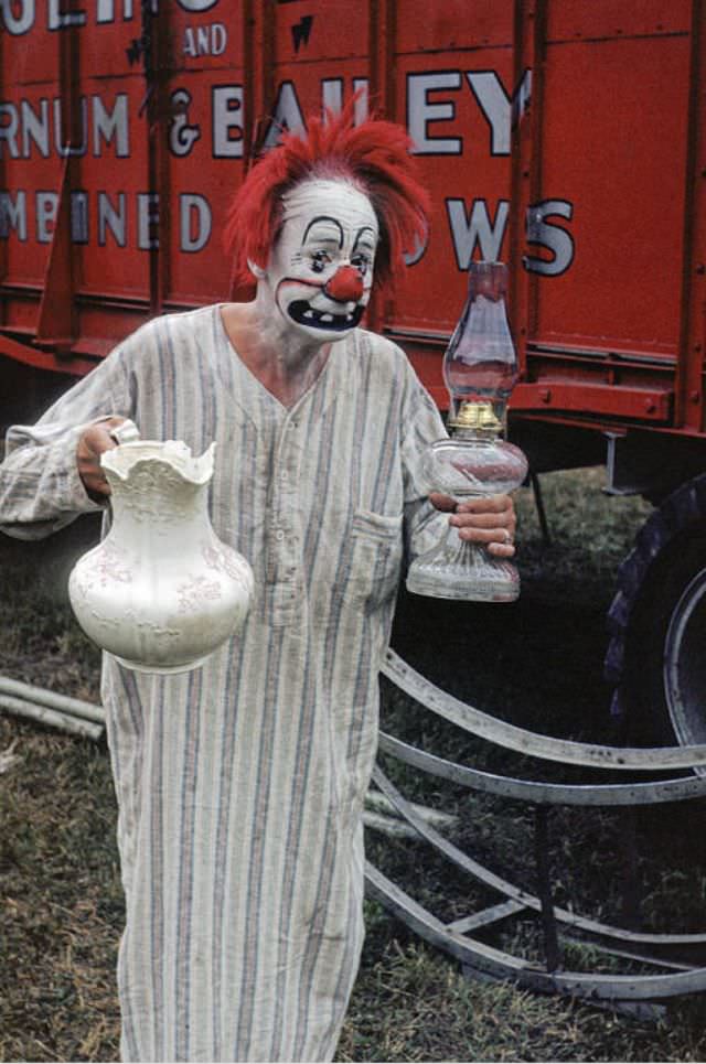 Paul Jerome, a clown with a pitcher and lamp.
