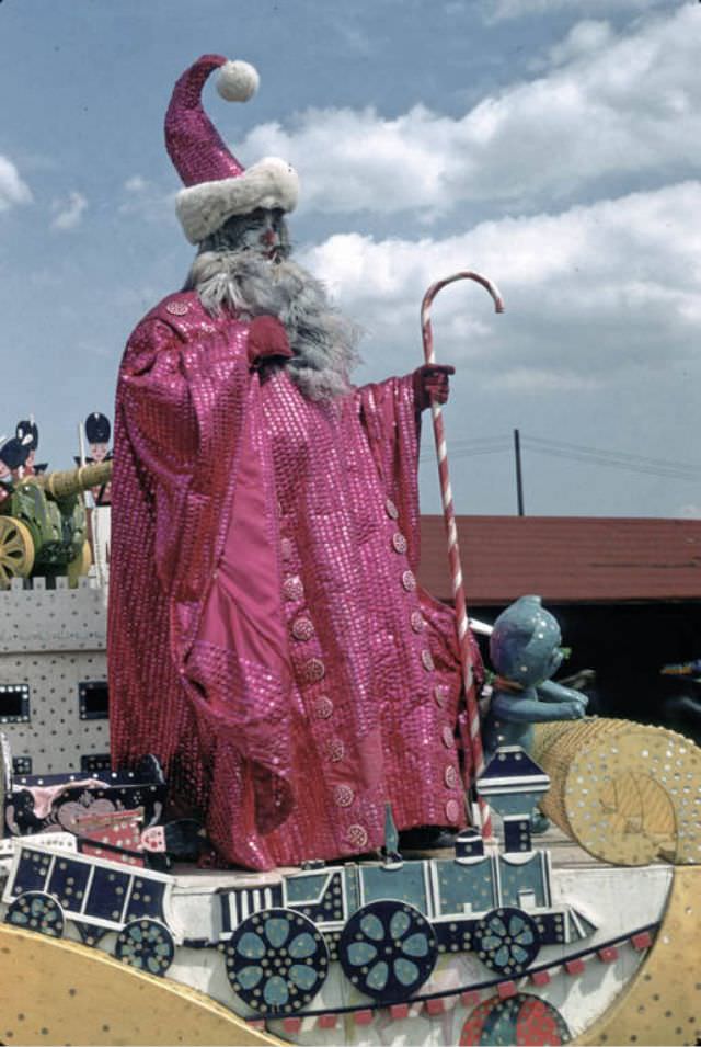 Felix Adler, a clown in spec wardrobe on a Holidays spec float.