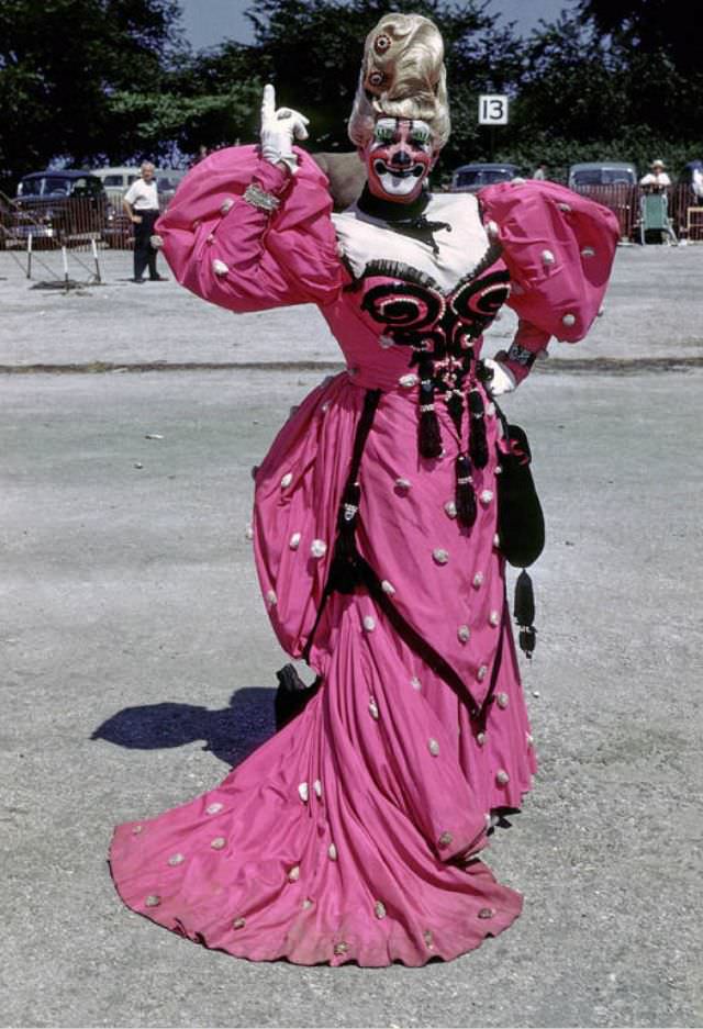 Ernie Burch, a clown in a long red dress.
