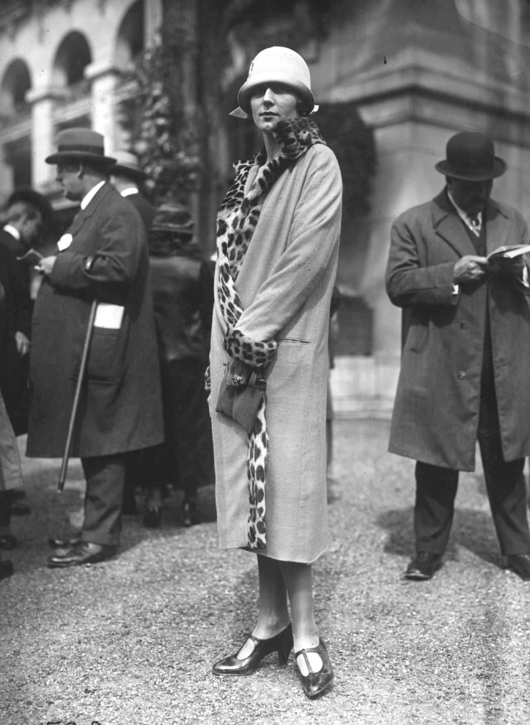 A simple wrapover coat with leopard skin trim, 1925