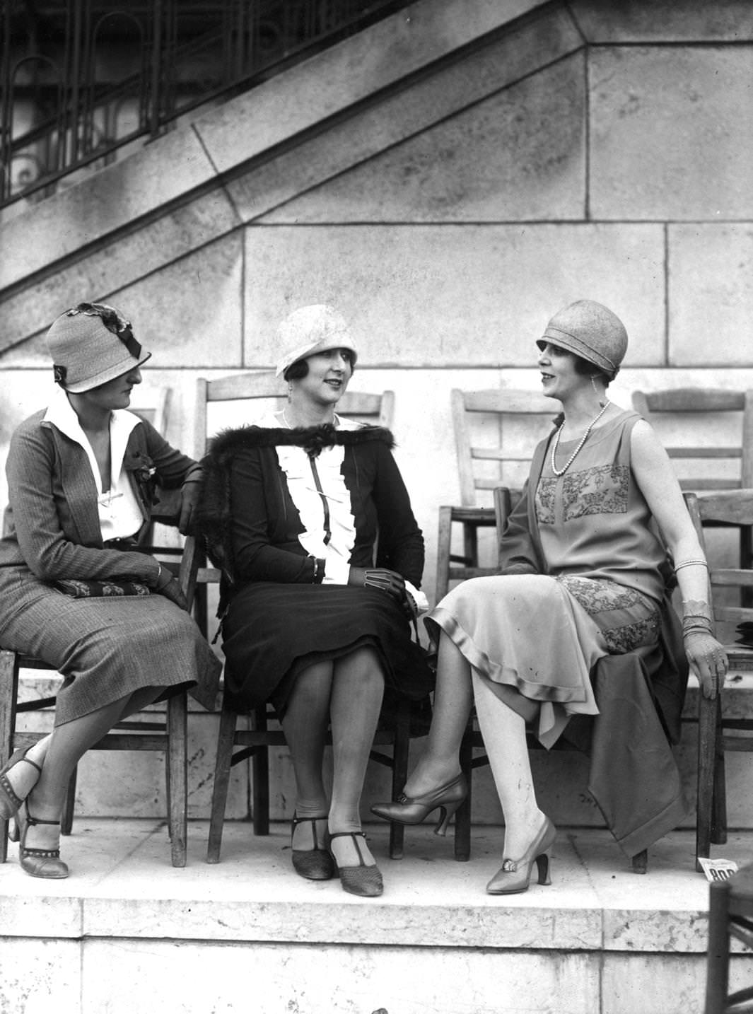 Three day time outfits worn with cloche-hats, shoes are high-heeled one-bar, t-bar and high vamp court, 1925