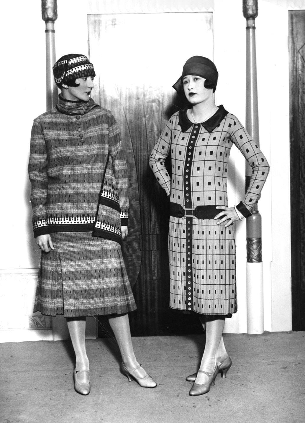 Two women modelling fashionable outfits and cloche hats, 1926