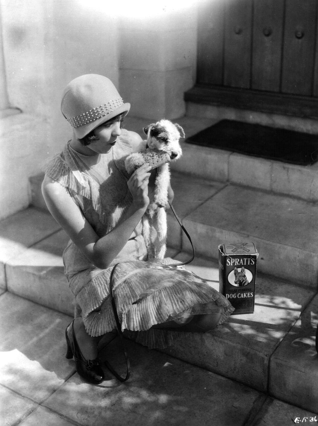 linor Fair, the Hollywood actress, with her wire haired terrier dog 'Rollo'. Elinor appeared in 'My Friend From India', 1926