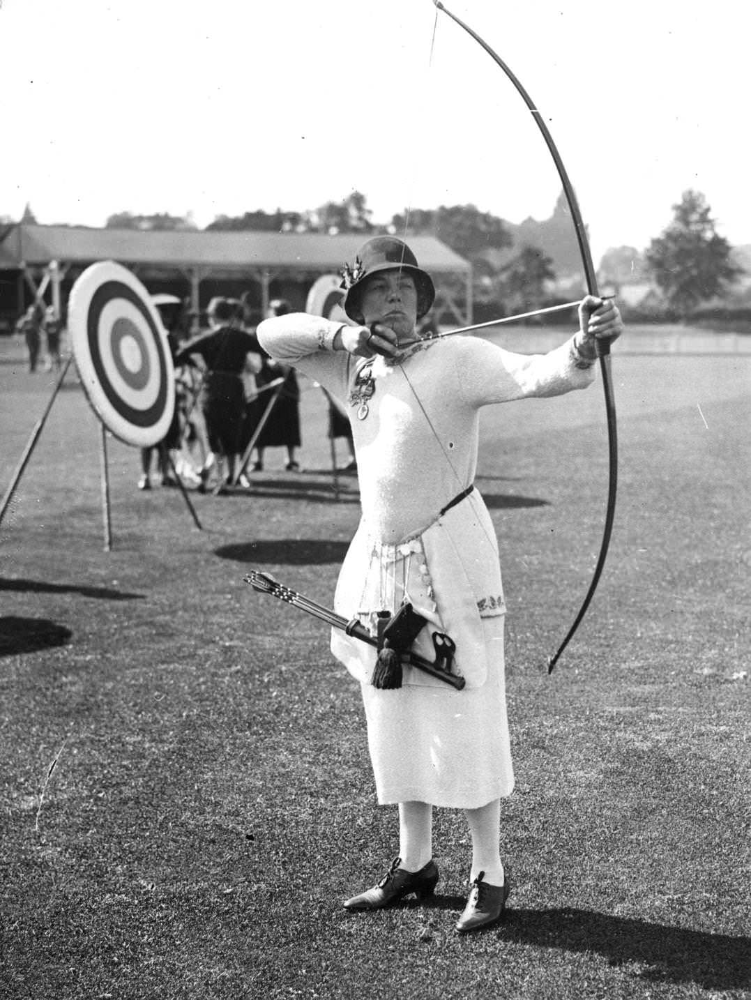 Miss V M Rushton pulls a bow at the Tunbridge Wells Archery Contest in Kent, 1920