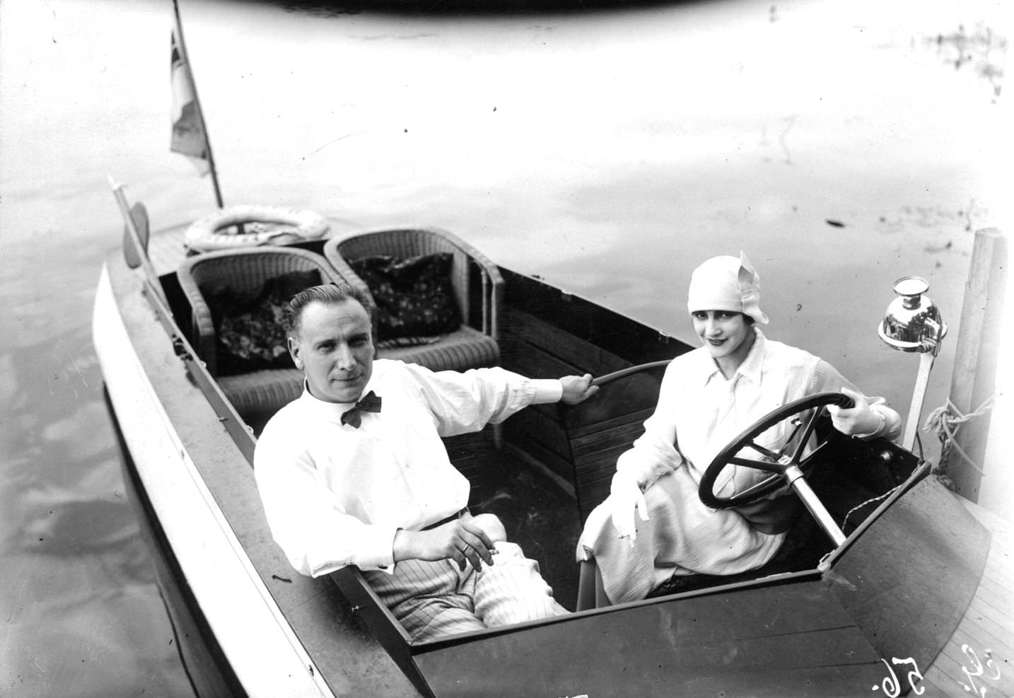 A couple relaxing on a boat during film production, 1920