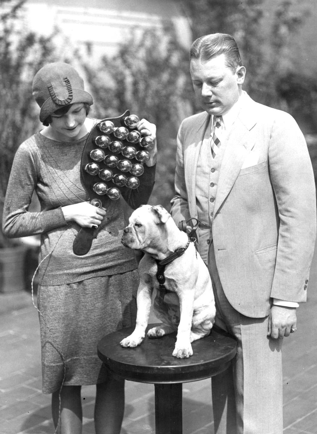 Ethel Lawrence christening the Radio Bull Dog at a ceremony on the roof of the Hotel Astor in New York City, with a christening radio device made by a radio engineer. G Clayton Irwin, 1920