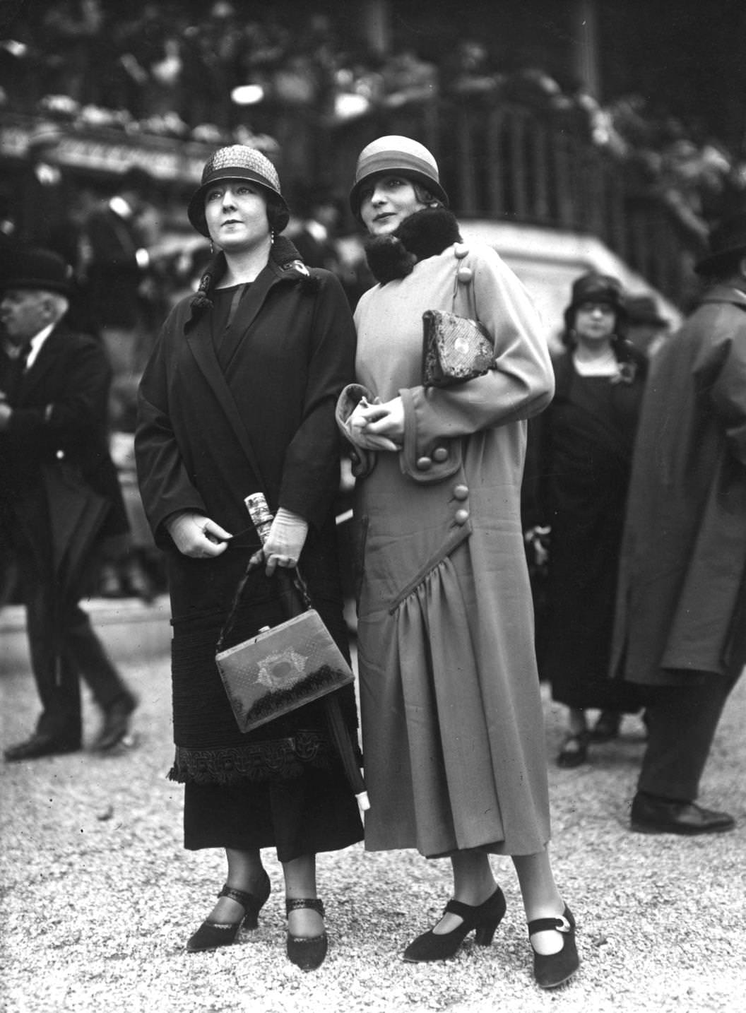 Two women in spring coats, both with cloche hats and handbags, 1924