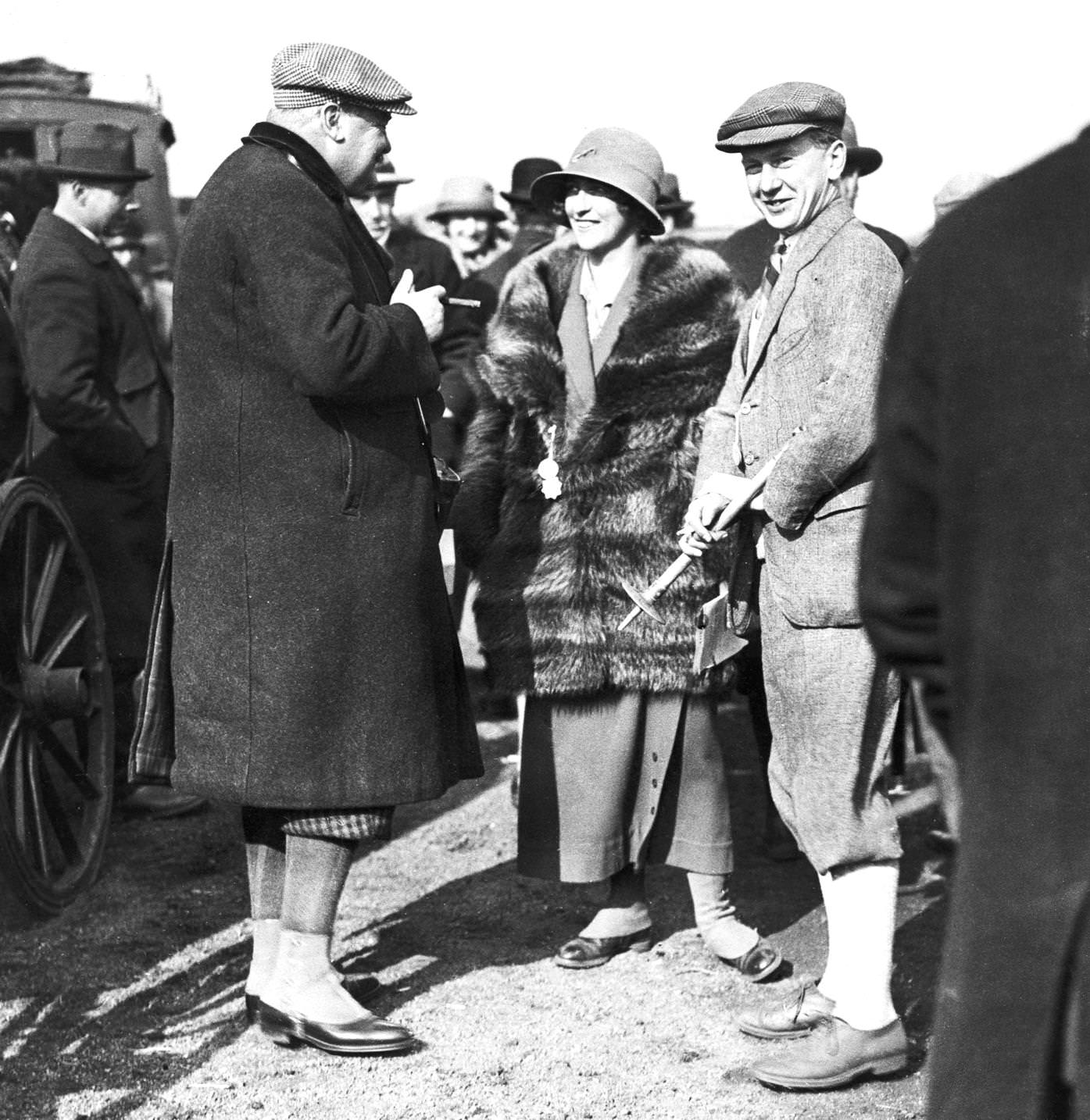 Sir Robert Jardine (left), Mrs Charles Glover and Captain Hog on the first day of the Waterloo Cup hare coursing event at Altcar, near Liverpool, 13th March 1924.