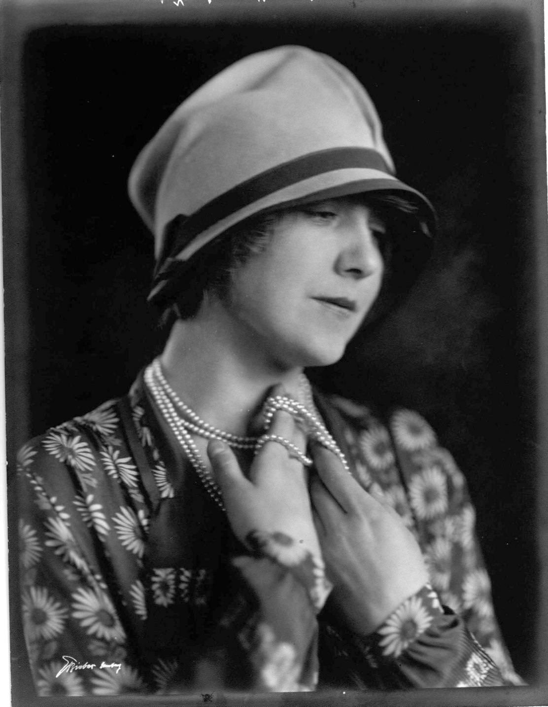 A young woman modelling a floral print top and a cloche hat, Hamburg, 1924.
