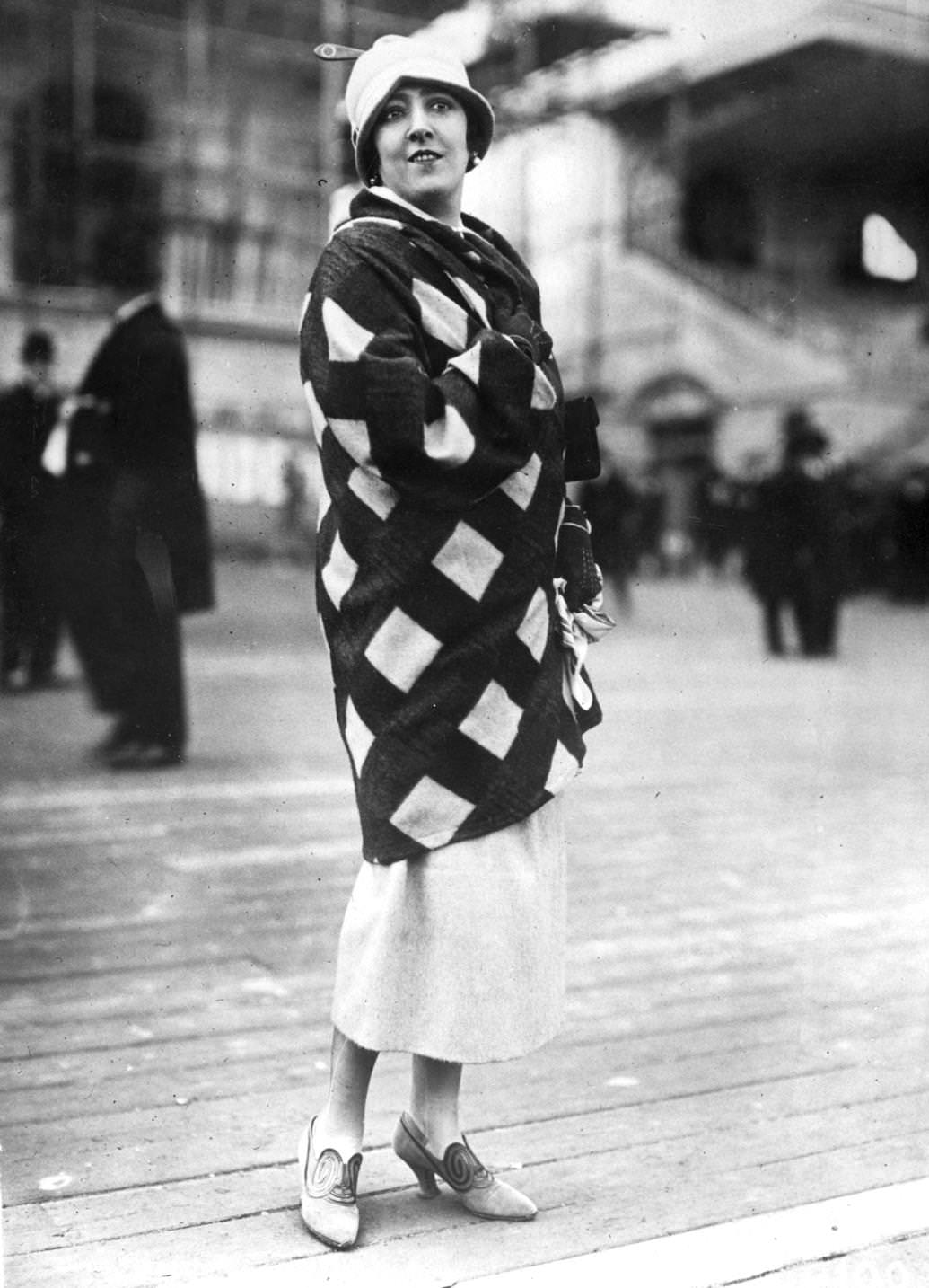 A rust and cream plaid velour coat from Paris, set to be the season's rage for sports and country wear, 1924