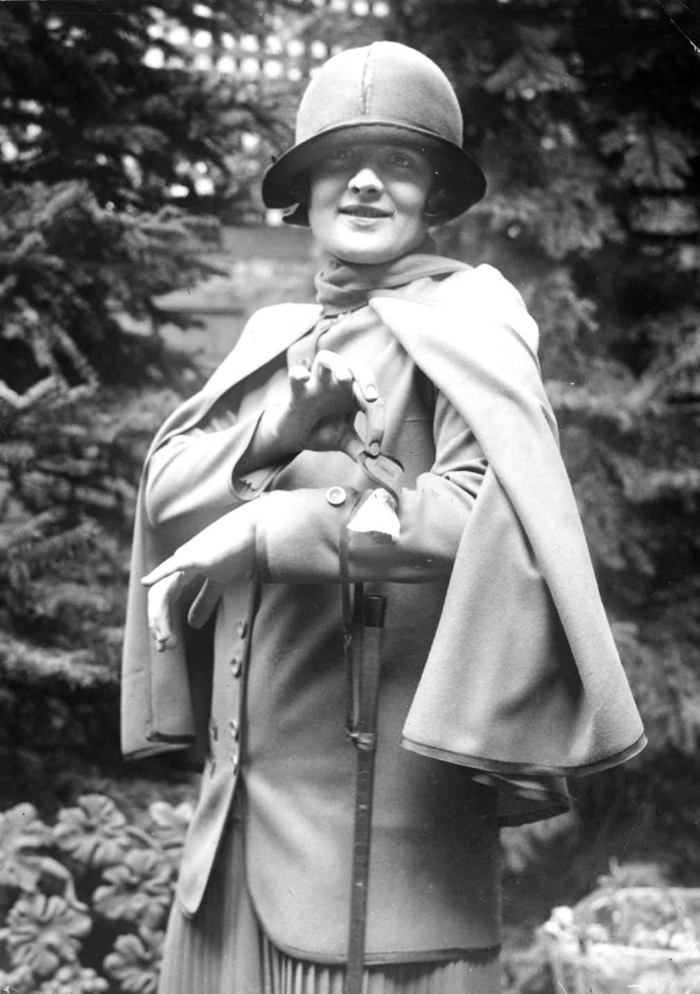 Hazel Nason demonstrates a pocket on the cuff of her jacket, which can be used to hold money, a handkerchief or a powder compact, 1924