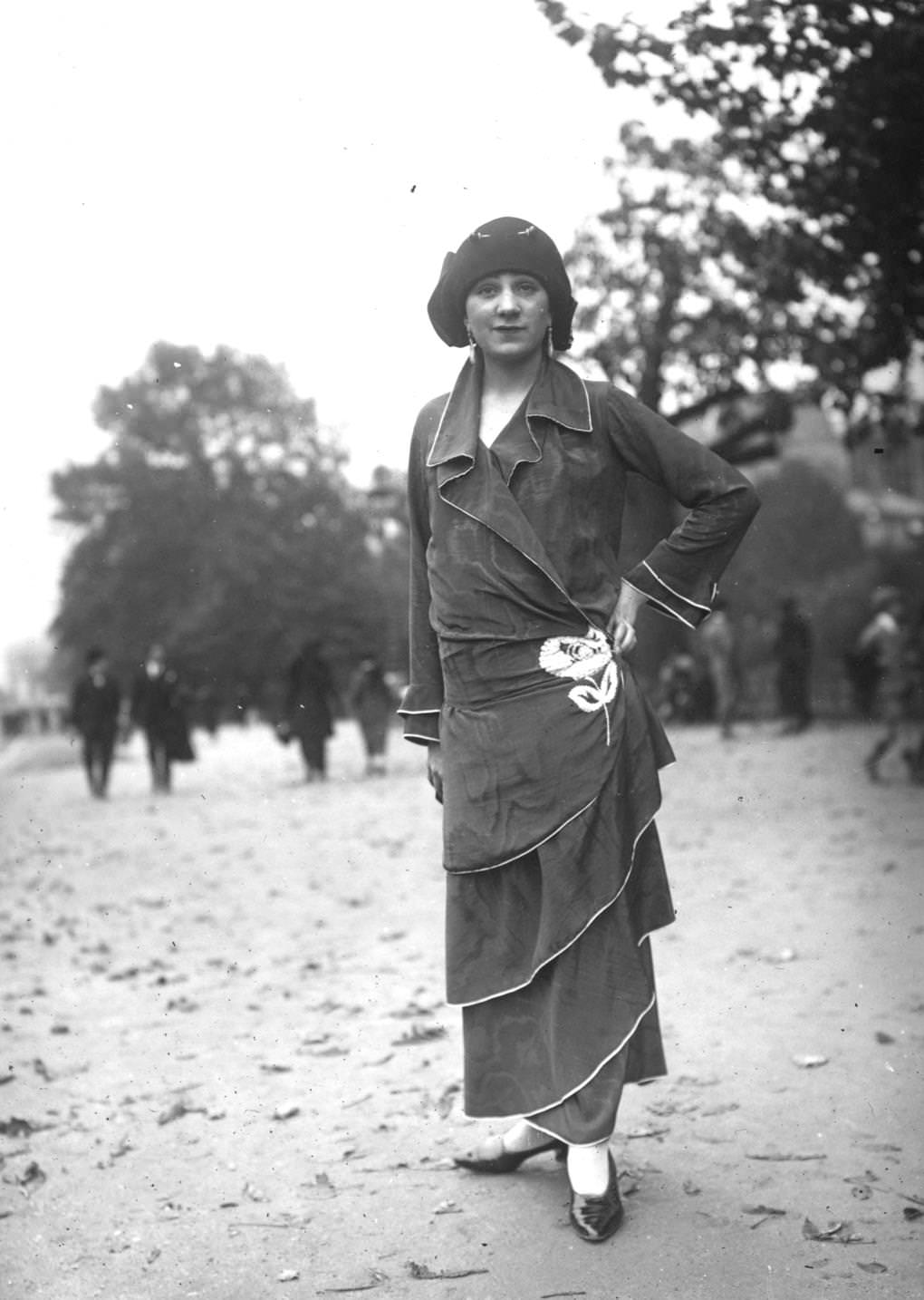 Tiered ankle length dress in watered silk, with an embroidered rose at the hip, 1923