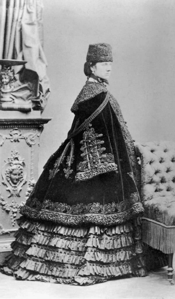nne Sutherland-Leveson-Gower (1829 - 1888), Duchess of Sutherland in a crinoline dress and velvet cape with astrakhan trim, 1860.