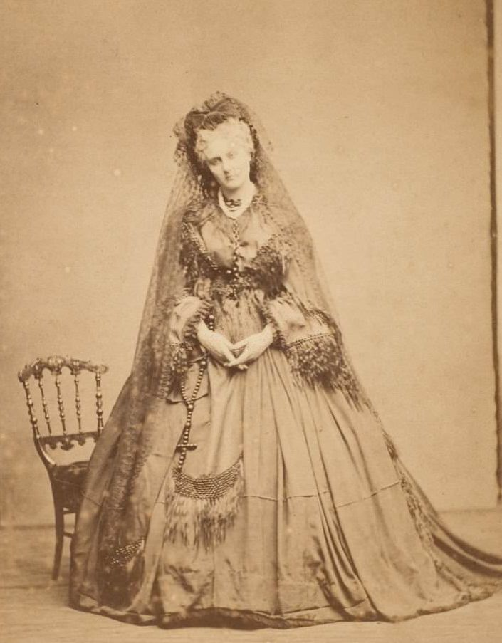 Standing with a Rosary, 1861