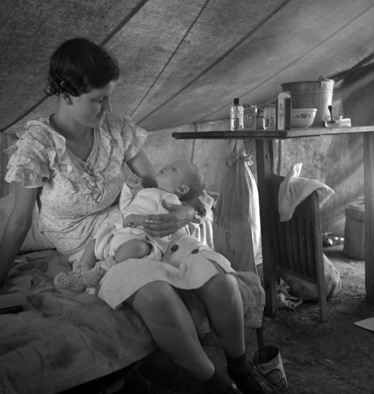 Young migrant mother with six weeks old baby born in a hospital with aid of Farm Security Administration medical and association for migratory workers, 1938