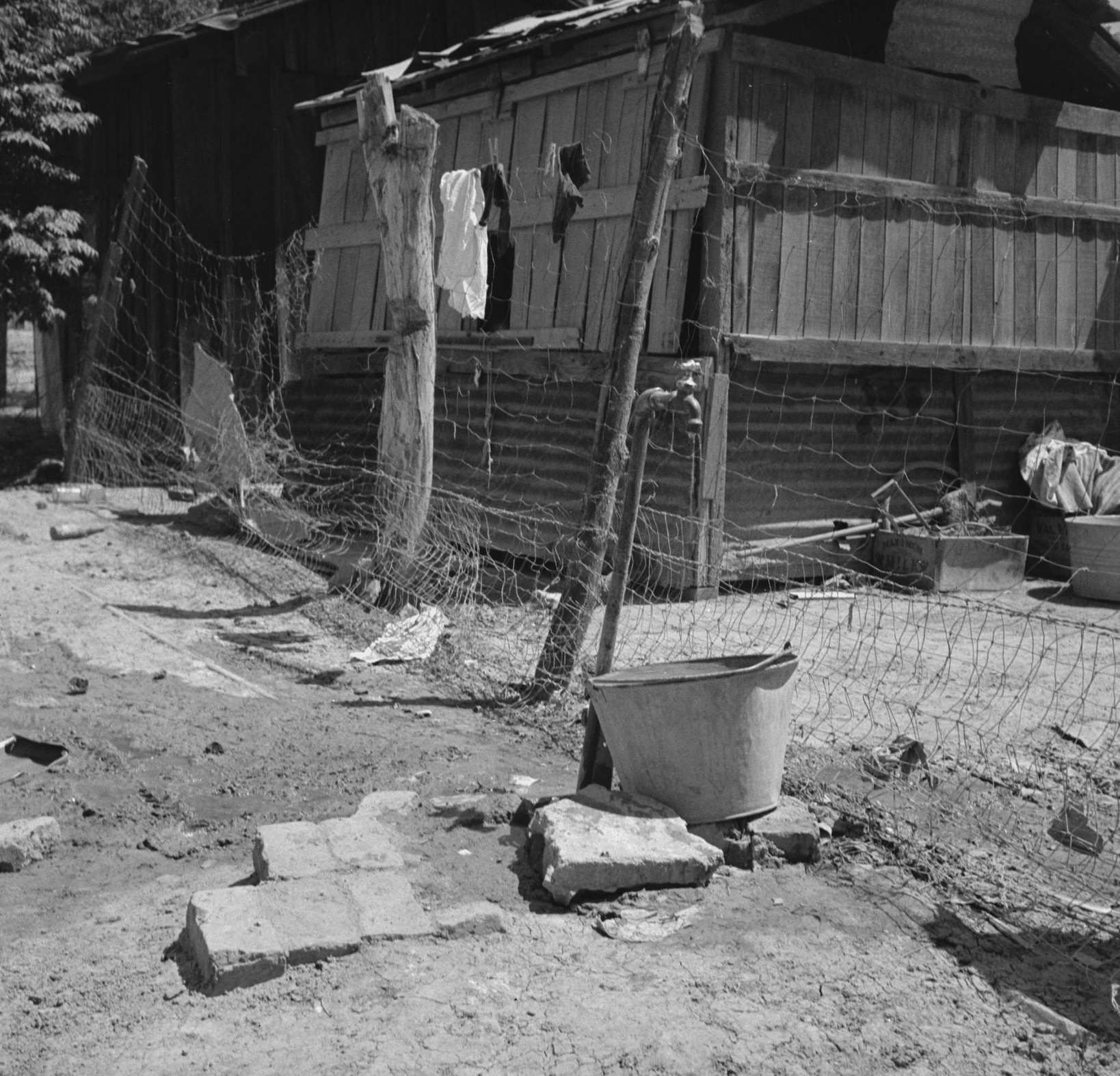 Home of Mexican field worker showing water supply. Brawley, Imperial Valley, California, 1930s