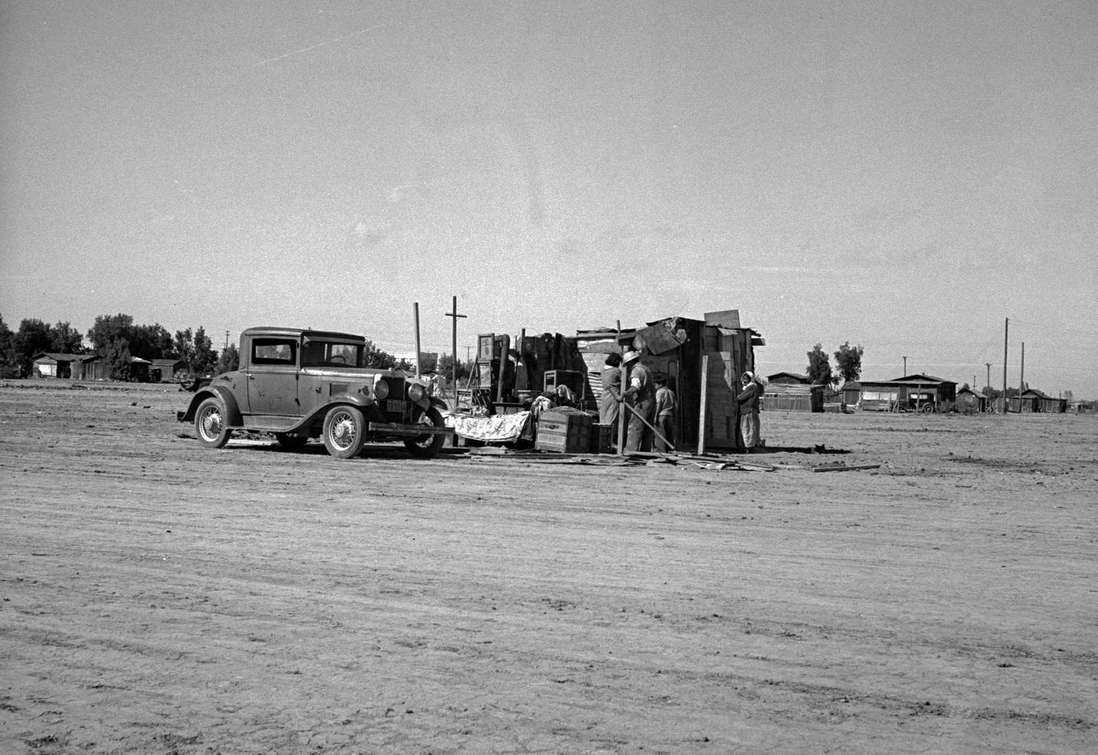 Housing of migratory field workers (Mexican) across road from Farm Security Administration camp (FSA) Near Calipatria, Imperial Valley, California, 1930s
