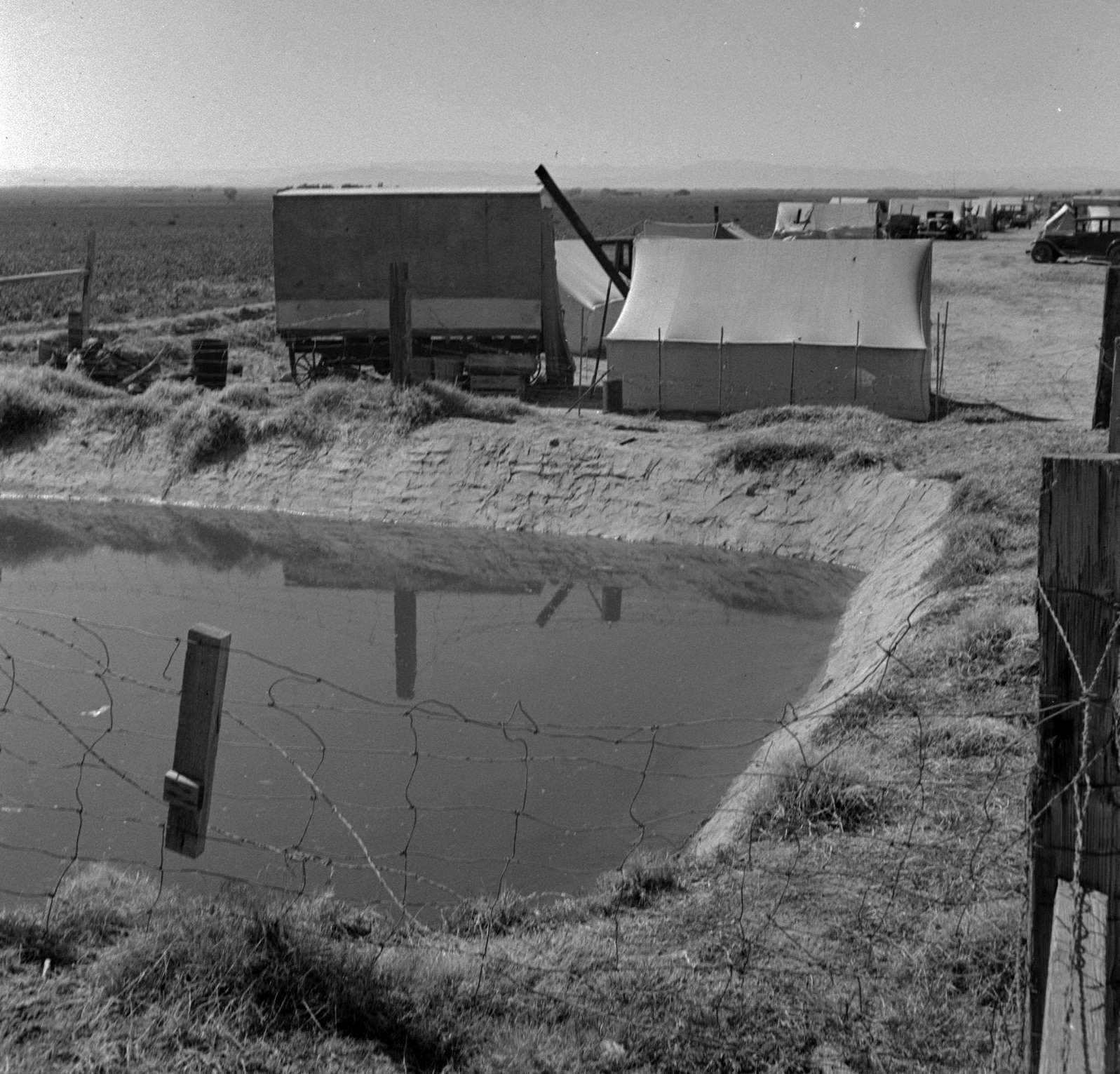 Ditch bank camp for migrant agricultural workers. California, 1937