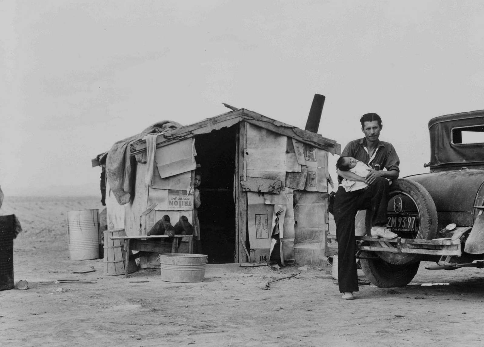 Migratory Mexican field worker's home on the edge of a frozen pea field. Imperial Valley, California, 1930s