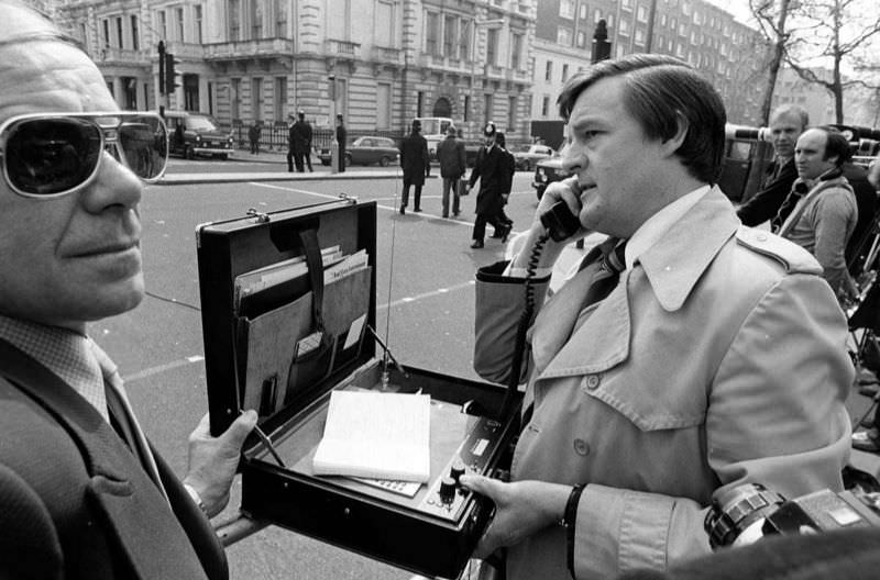 An early mobile phone used by a reporter, Kensington, London, 1983.