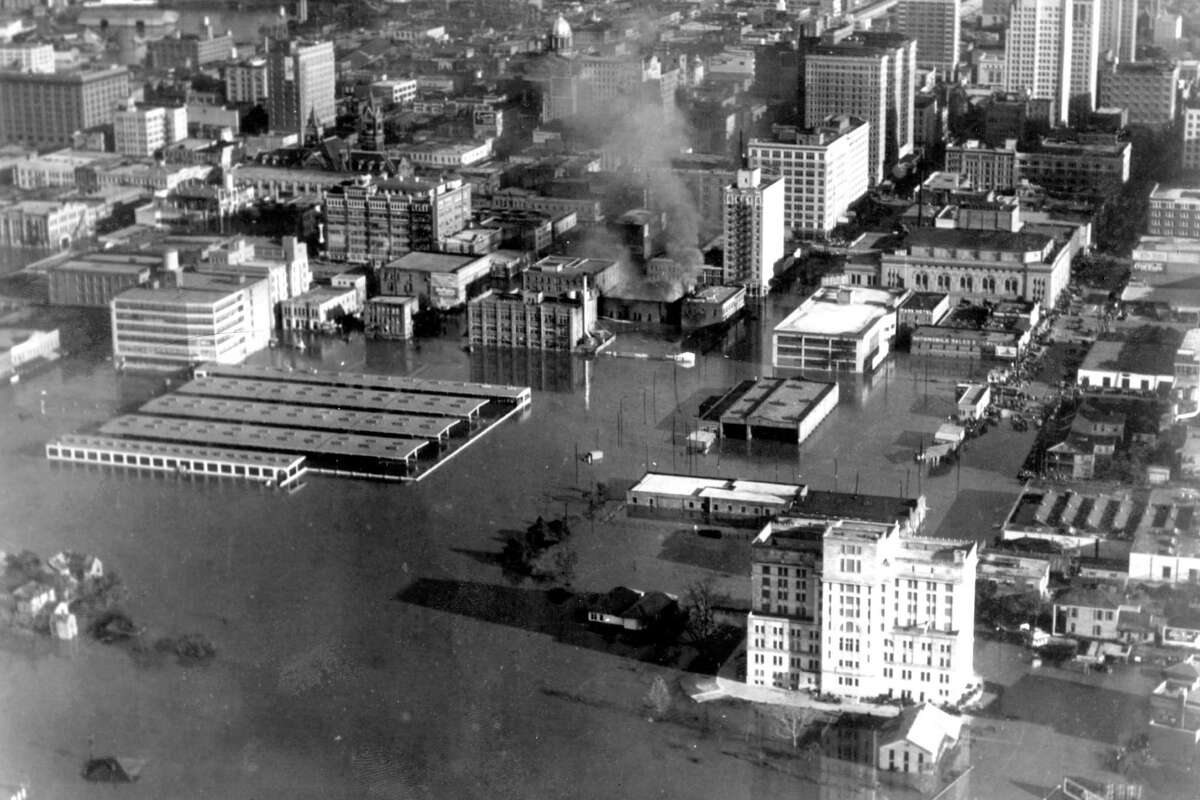 Looking east over downtown, December 1935. White building at foreground is the criminal courthouse, where the back of Bayou Place is today. Structure at right-center is the farmer's market, where Wortham Center is today.