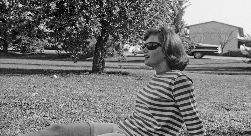 Coed watching the picnic baseball game, 1966