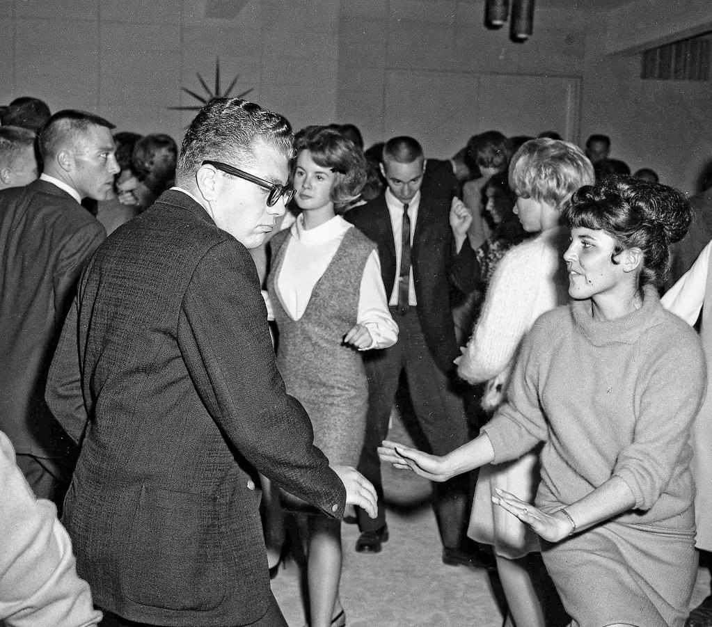 Dennis & Rita at post game party, 1963