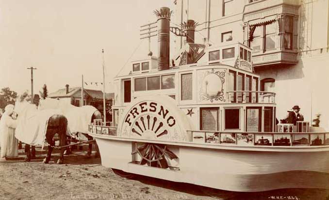 View of horse-drawn float decorated like the steamboat, Fresno, 1895