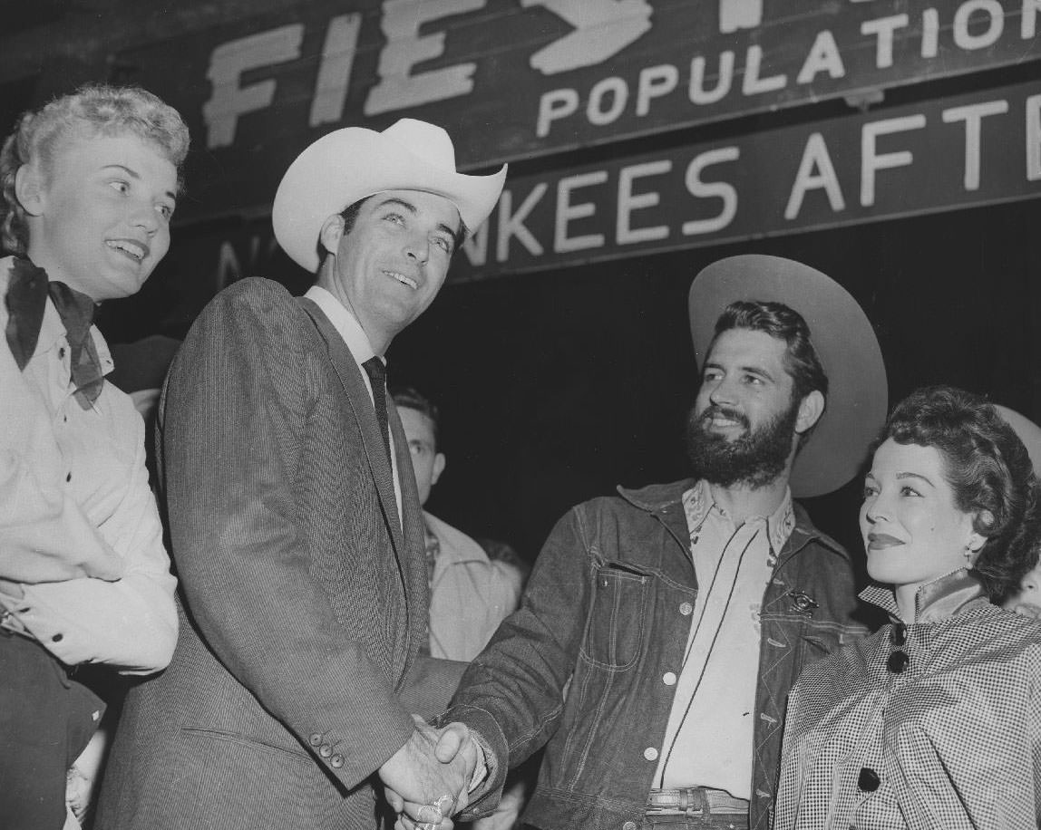 Handshake at Fiesta City gate, 1950s