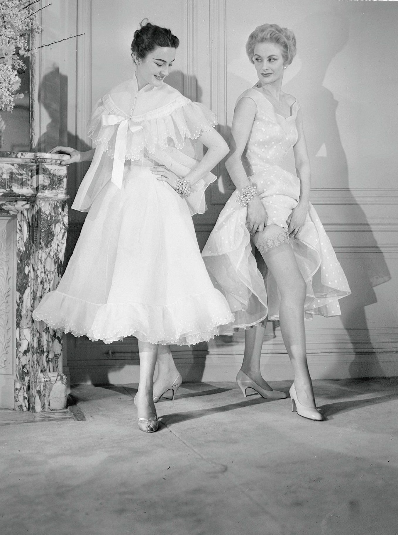 Two Female Models Wearing Frilly Undergarments