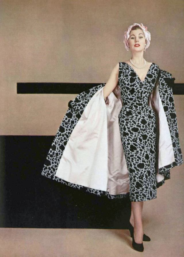 Stella in black and white silk ottoman cocktail sheath with matching coat lined in pink satin by Jacques Fath, 1953