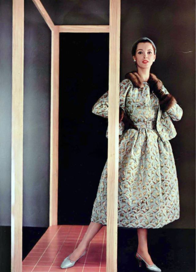 Ann Farrar in sumptuous brocade dress and jacket trimmed in mink by Jacques Fath, 1954