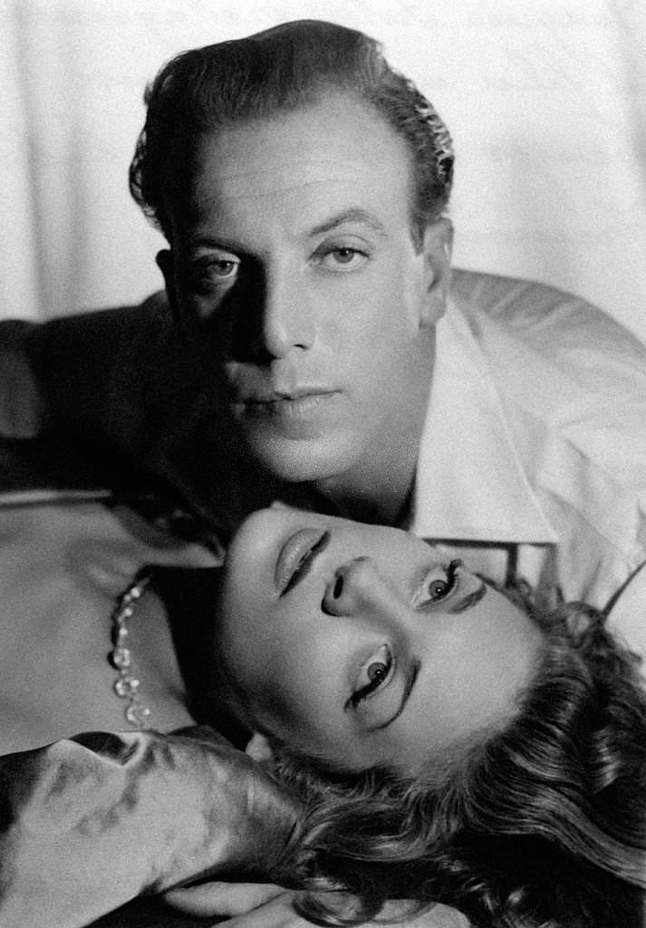 French fashion designer and actor Jacques Fath and French actress Francoise Christophe acting in the film Scandale aux Champs-Elysées, 1949.