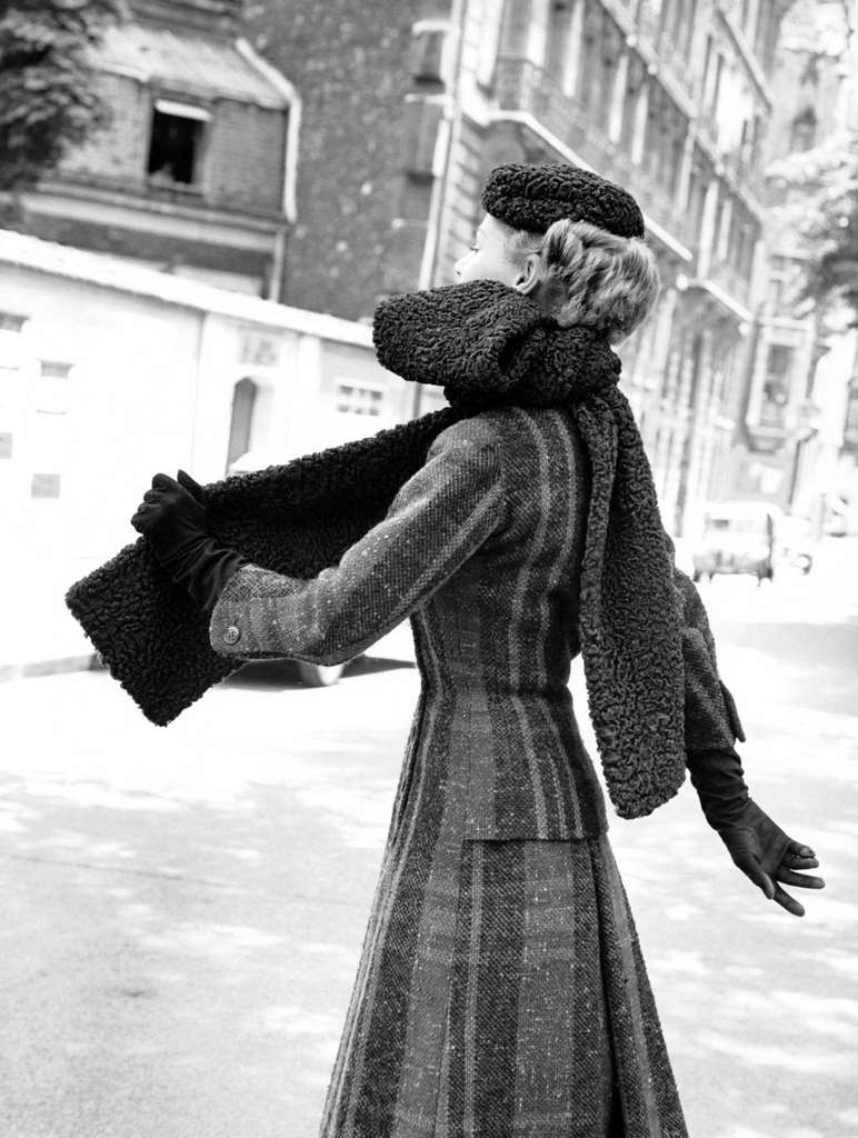 Red and green tweed dress with a long black astrakhan stole tied as a tie, a black astrakhan hat completes this set. Created by Jacques Fath, Paris 1955.
