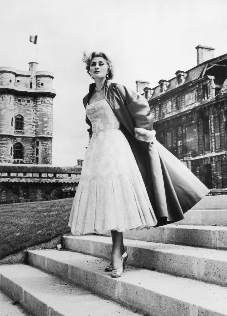 A Model Presenting An Ensemble (Dress And Coat) From The Jacques Fath Fashion House, 1955