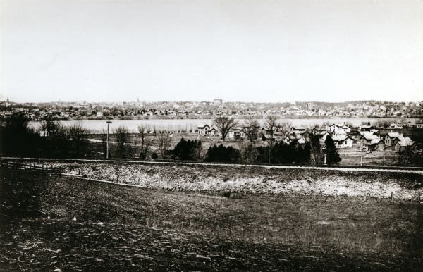 View from the south, with a railroad in the foreground, a river in the middle distance, and Janesville in the background, 1893