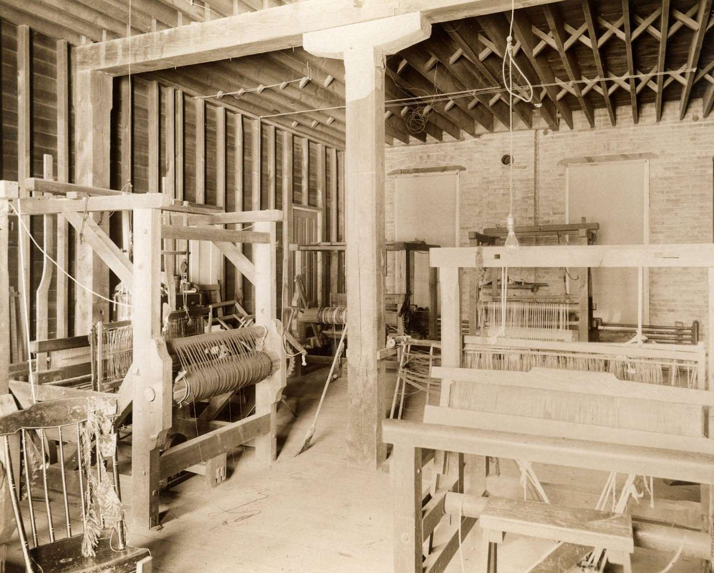 Several looms in the instructional weaving facility at the State School for the Blind, Janesville, Wisconsin, 1893.