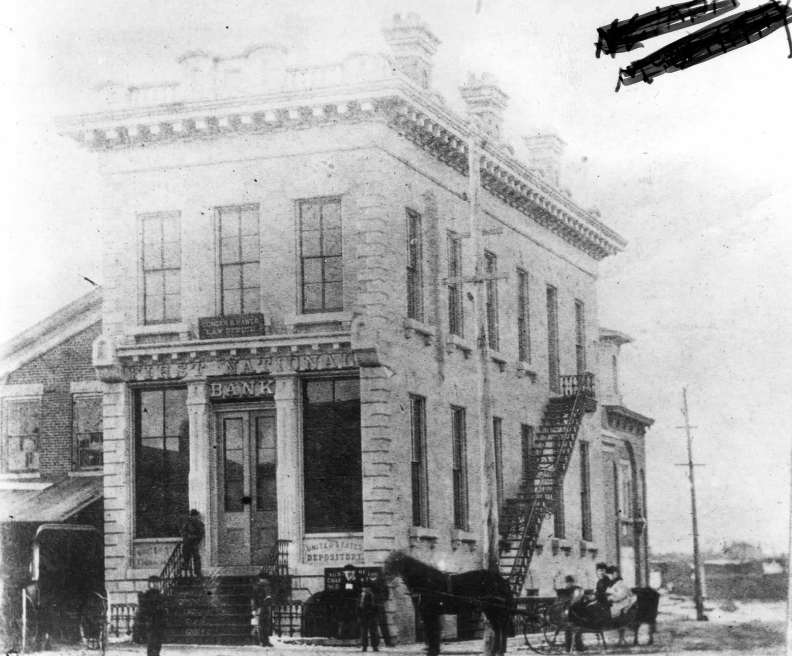 The First National Bank at the corner of River and Milwaukee Streets, 1890s.