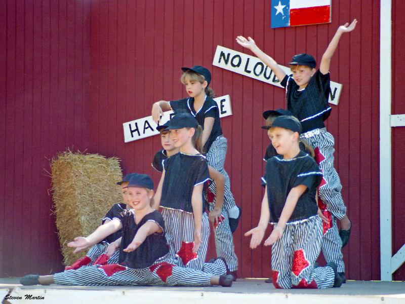 Girls from a dance school strike a pose, Keller, 1995