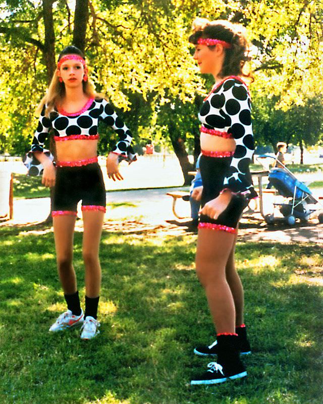Two girls chat before a dance performance, Keller, 1995