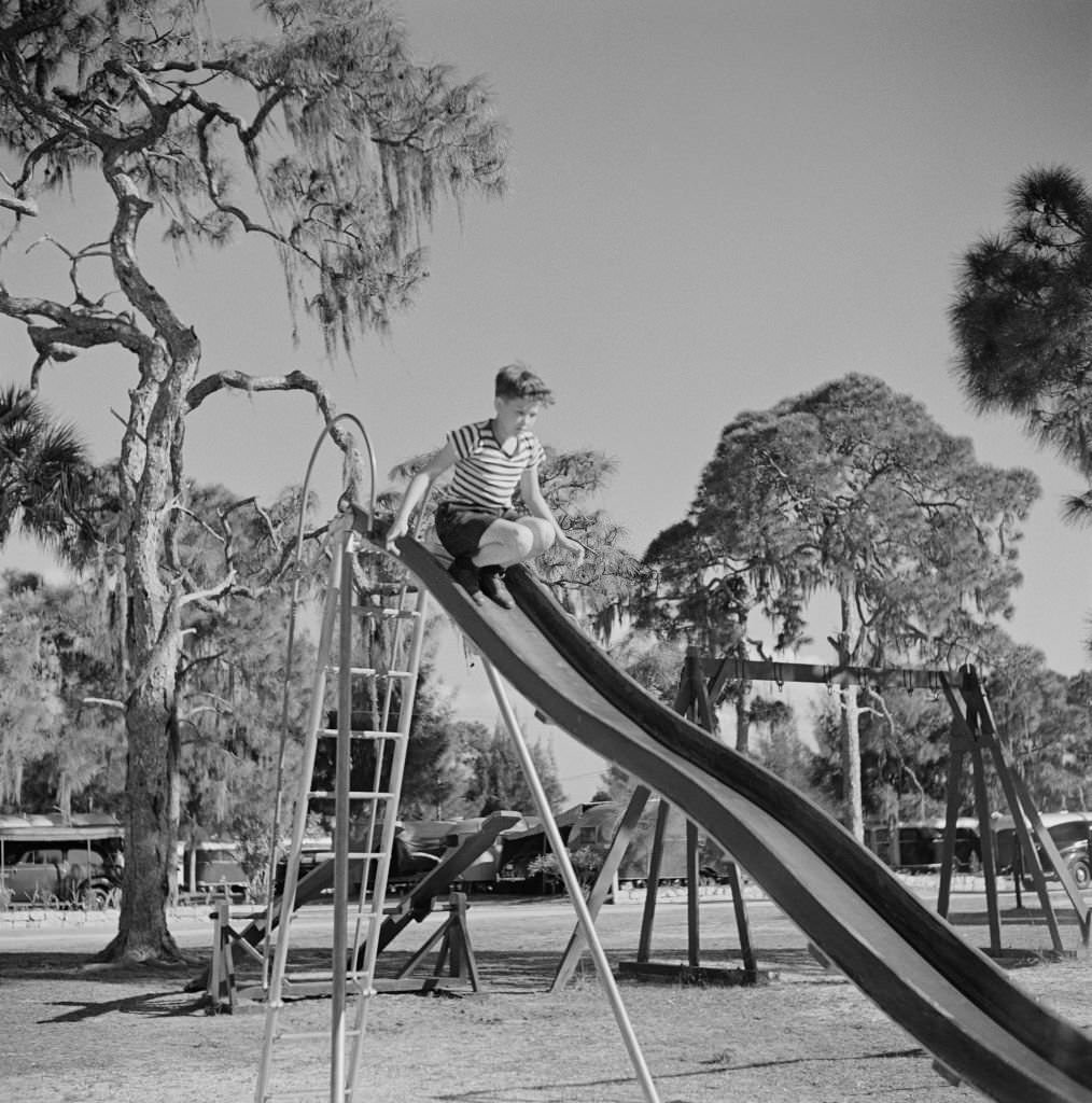 Boy on Playground Slide, Sarasota Trailer Park, Sarasota, Florida, January 1941