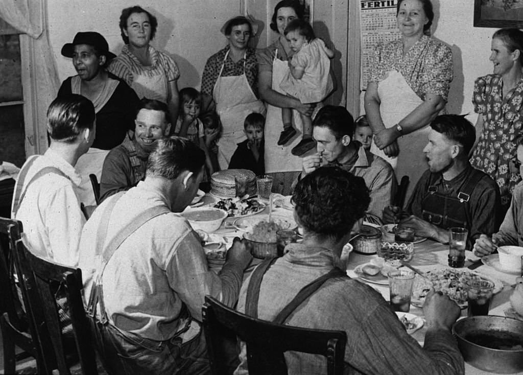 Members of the Wilkins family at home near Stem, North Carolina, enjoying a family meal, November 1939