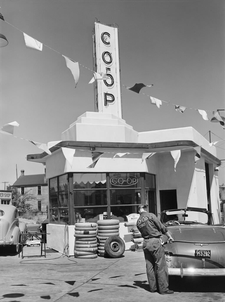 Man pumping Gas at Co-Op Gas Station, Minneapolis, Minnesota, August 1941