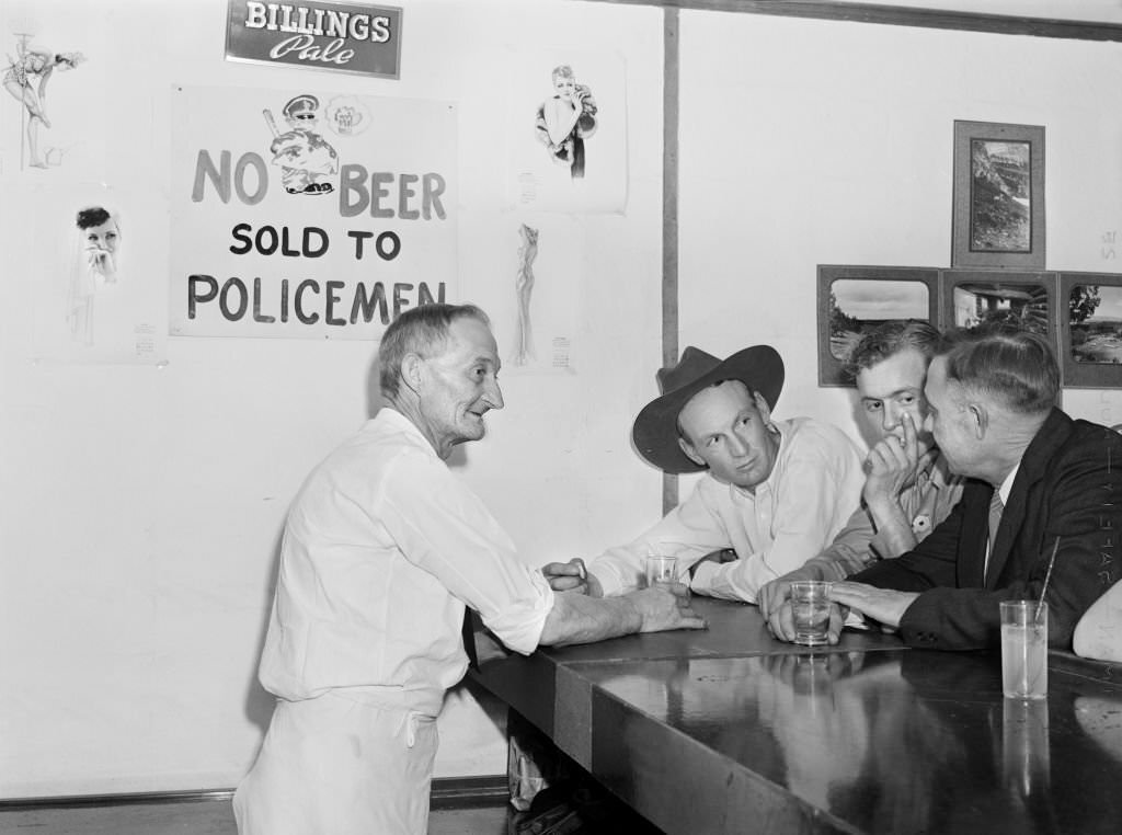 Patrons and Bartender at the Bar on Saturday Night, Birney, Montana, August 1941