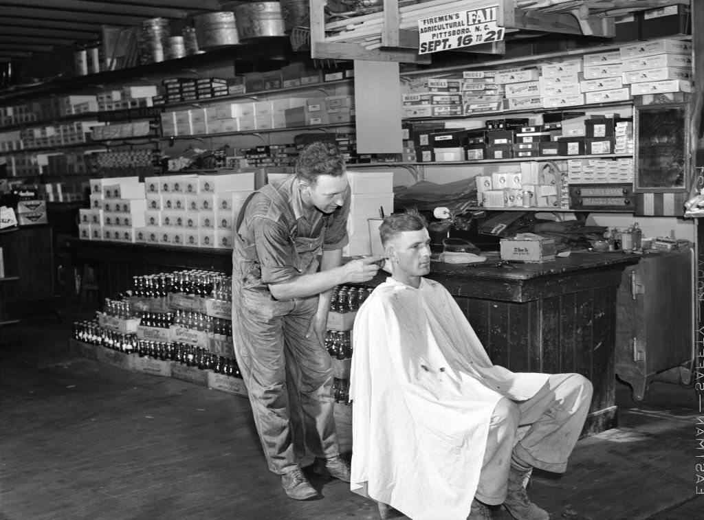 Free haircut on Saturday morning in W.M. Scott's general store. Farrington, Chatham County, North Carolina, September 1940