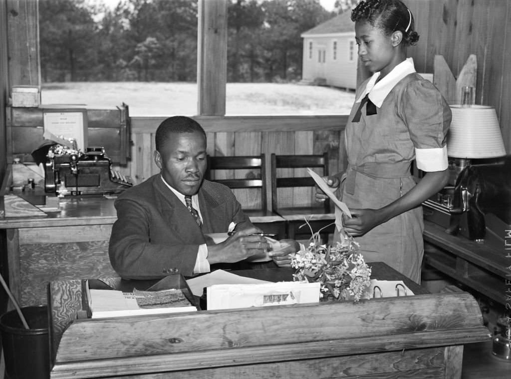 Students learning Office and Secretarial work by helping Principal Robert Pierce, Gee's Bend, Alabama, 1939