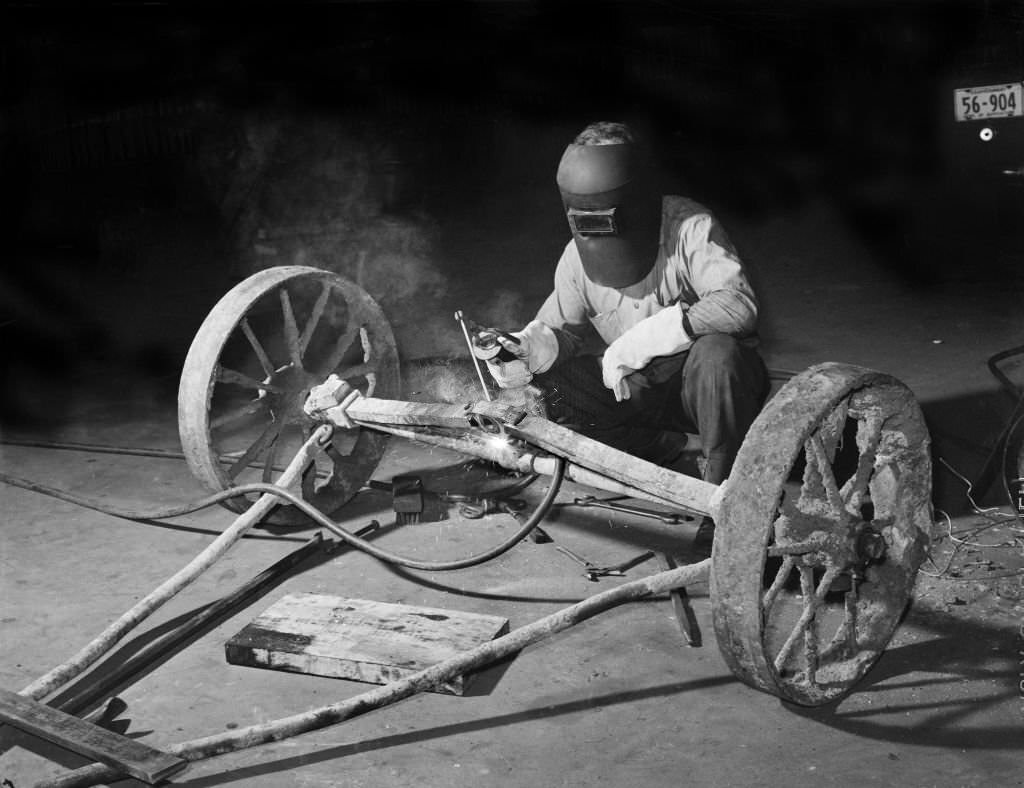 Mechanic welding Axle, Atlanta, Georgia, 1939