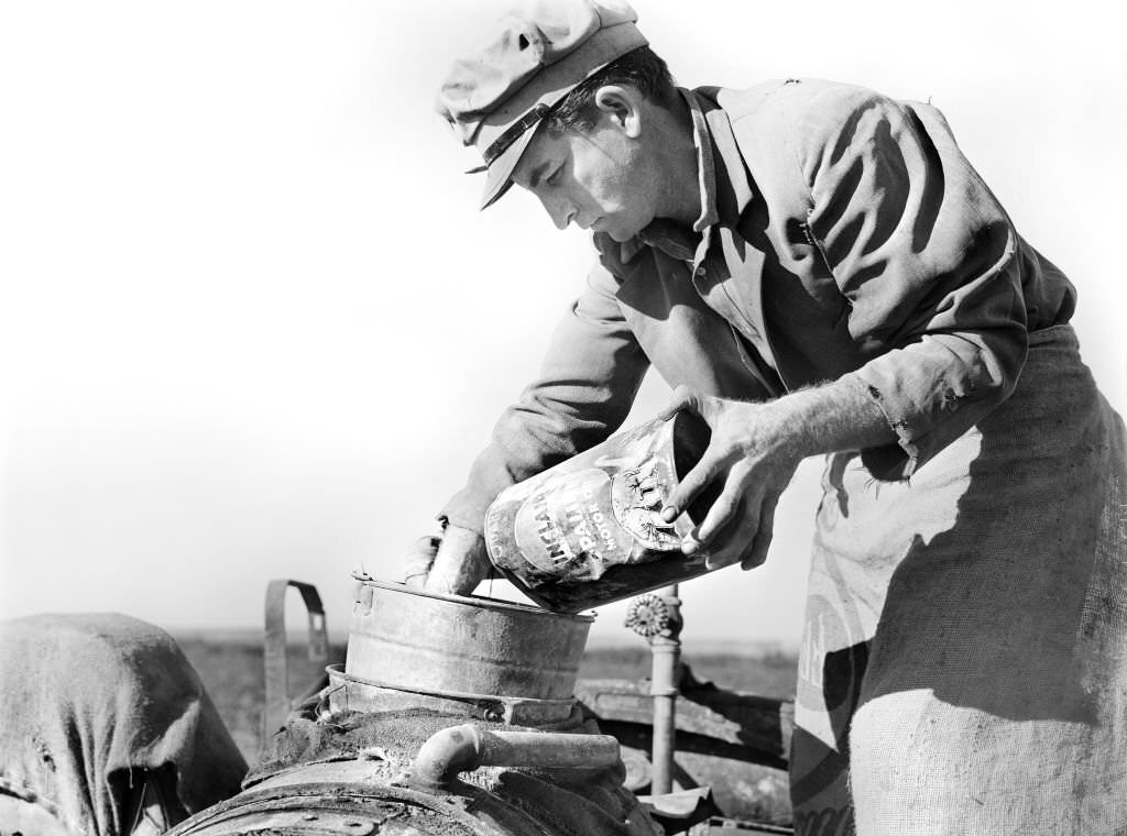 Migrant Day Laborer mixing Spray to kill White Flies and nourish Bean Plants, near Belle Glade, Florida, 1939