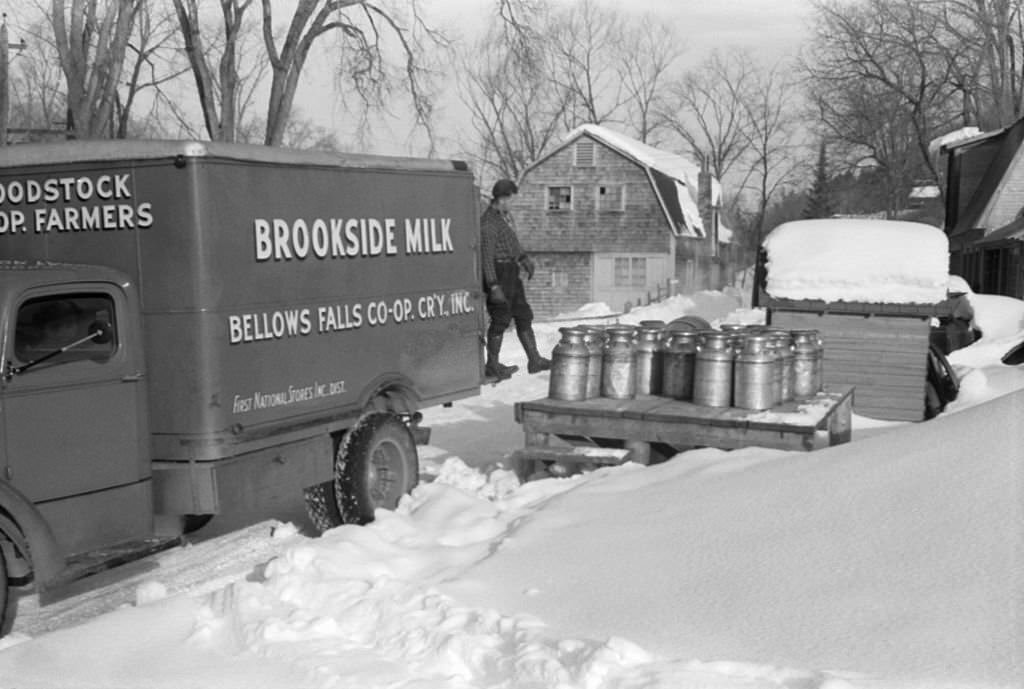 Farmers bring their cans of milk to the crossroads early every morning where it is picked up by the Bellows Falls Co-op Creamery truck and is taken to Brookside Milk Company in town, Woodstock, Vermont, 1939.